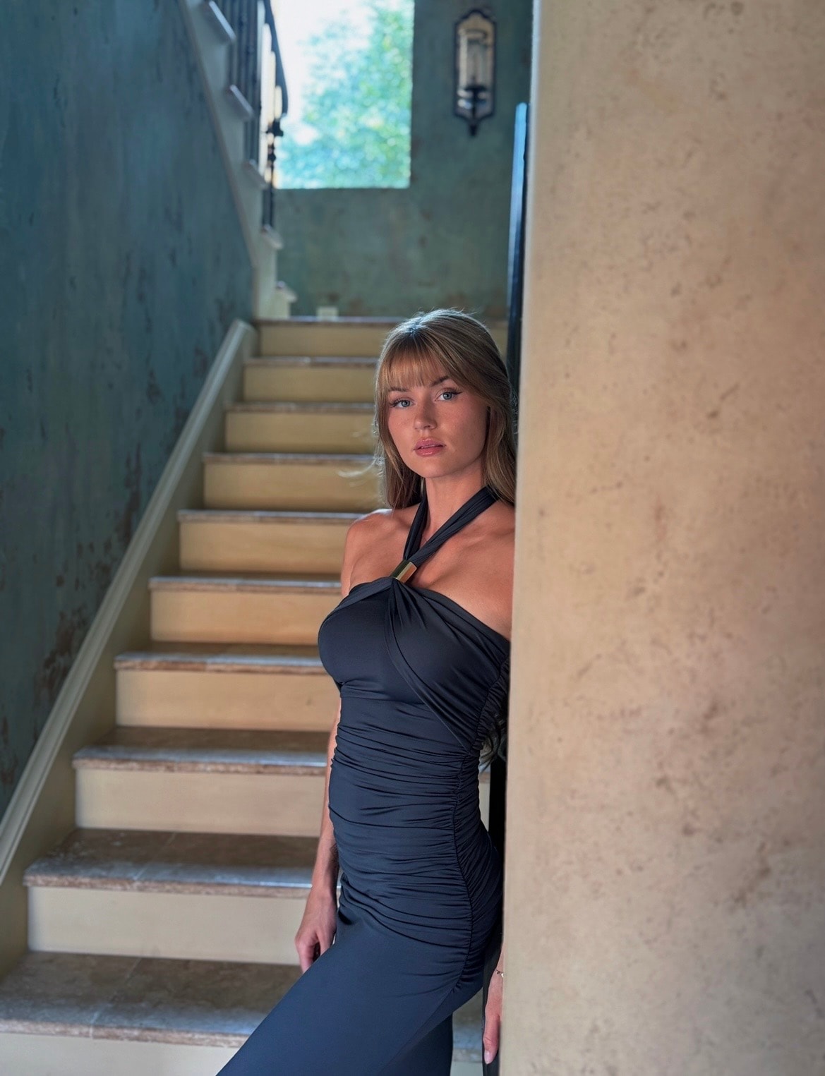 Ferrell on the staircase, poised and unhurried